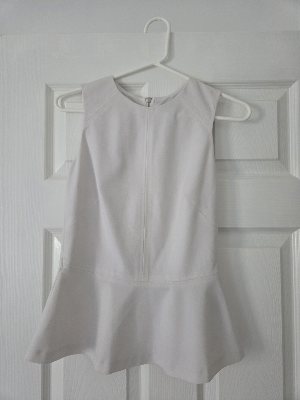 le chateau White Sleeveless Peplum Top